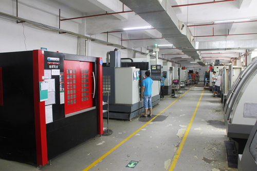 Overview of a modern manufacturing facility, showcasing various machines and processes