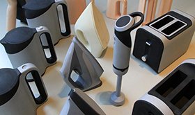 A sample part for a consumer appliance with a flawless high-gloss painted finish